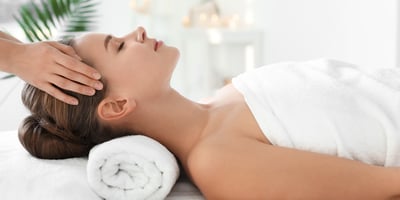 A woman is relaxing in a massage.